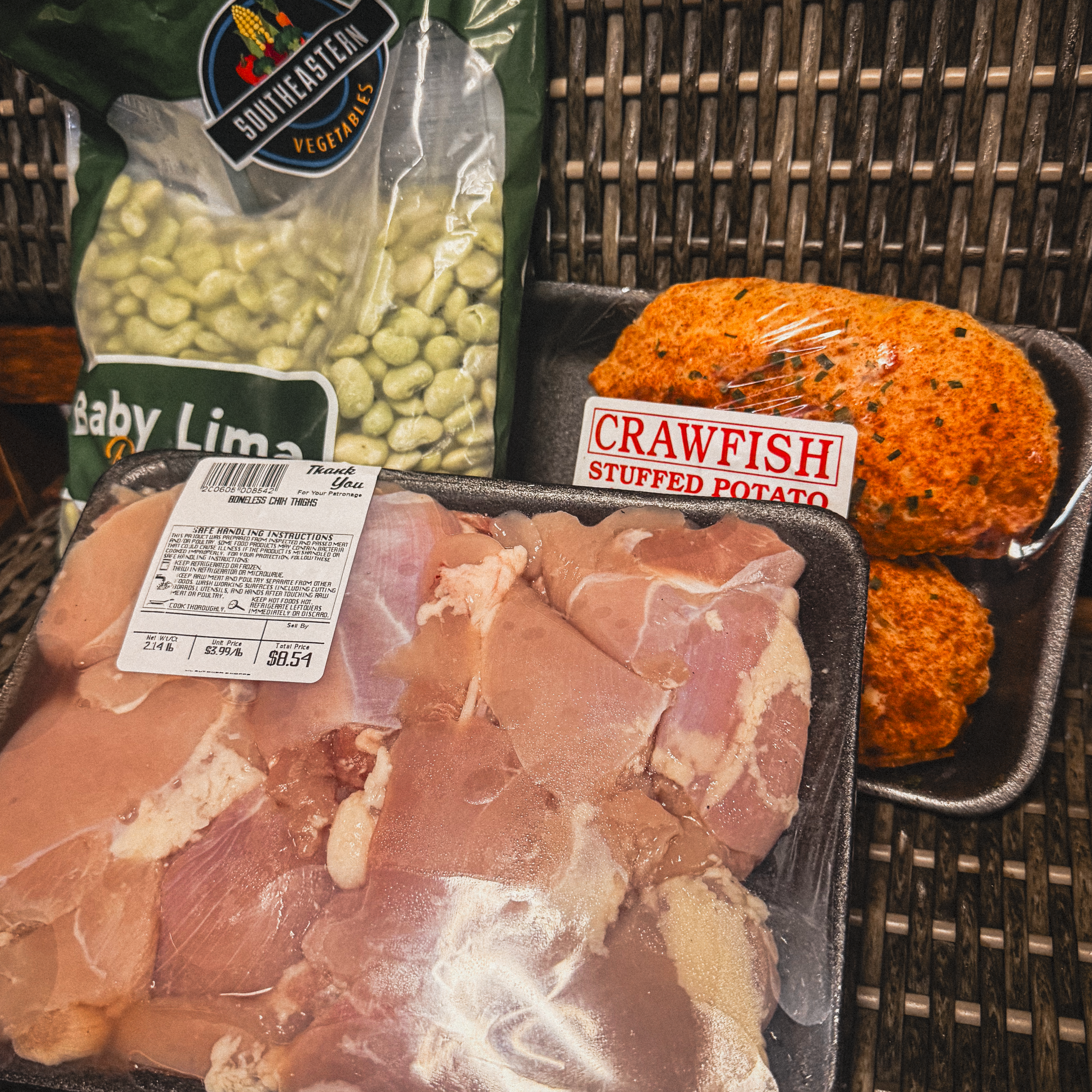 Everything for an oven roasted chicken thigh dinner: Chicken thighs, lima beans, and crawfish potatoes