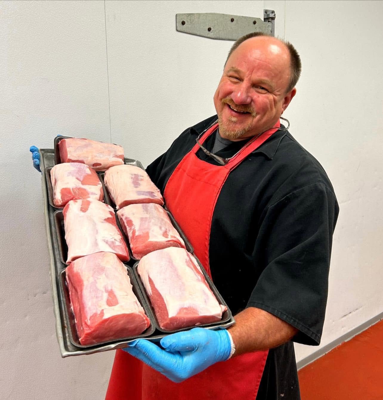 Scott holding pork loins